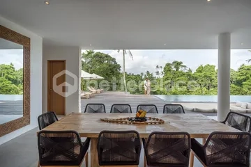 Curved Modernist Luxury Above Ubud's Jungle Canyon